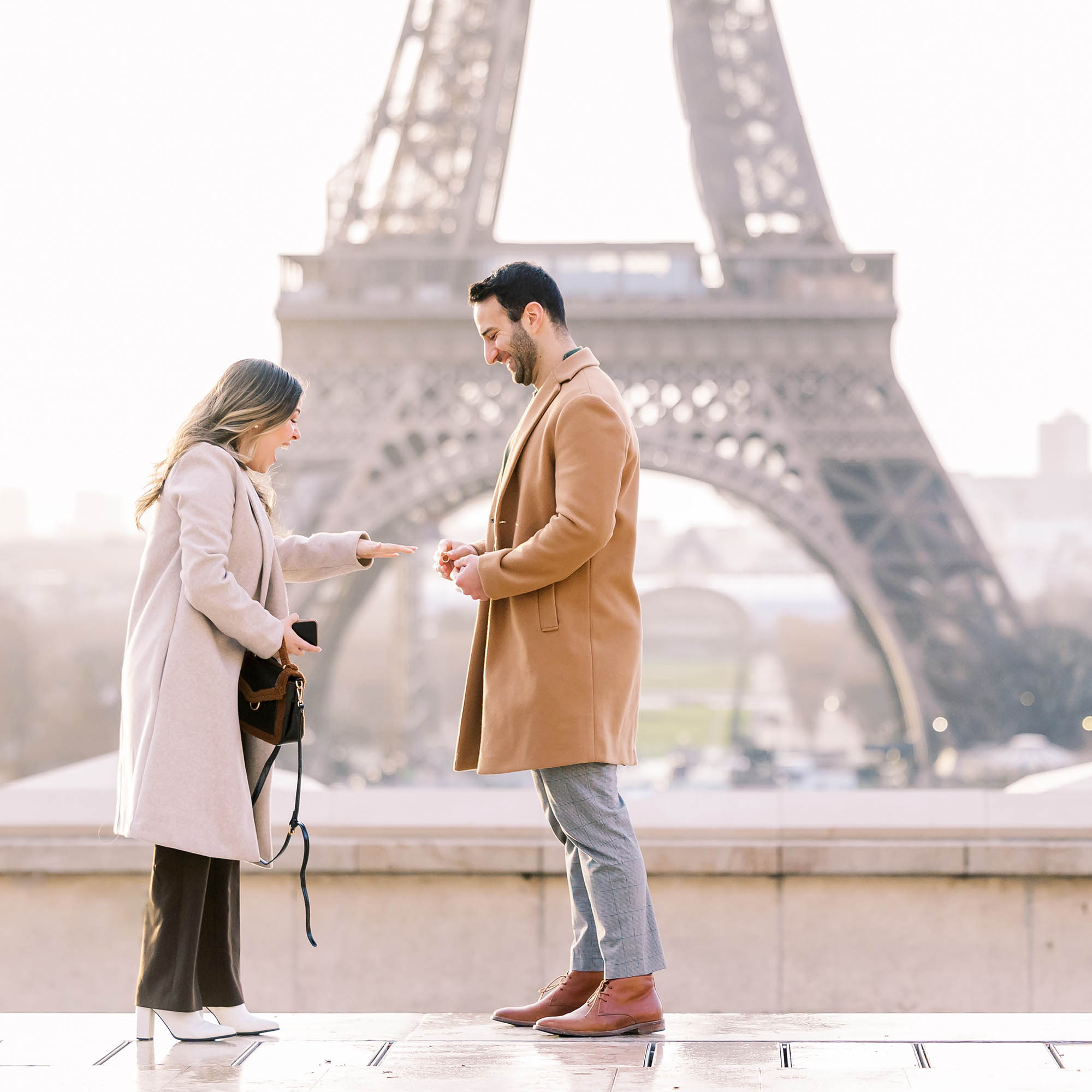 surprise proposal in front of the eiffel tower