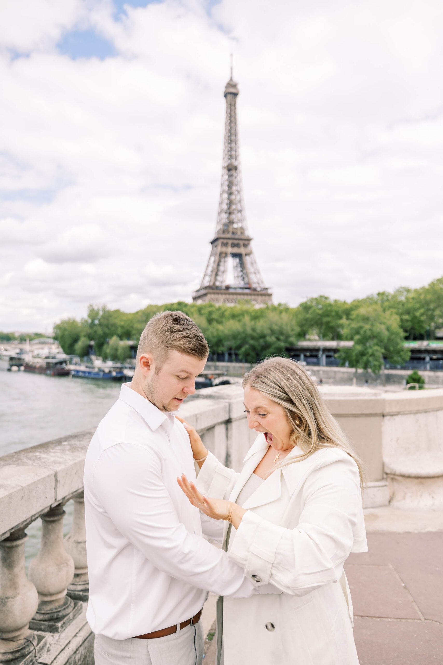 girl can't believe she was just proposed to in front of the eiffel tower