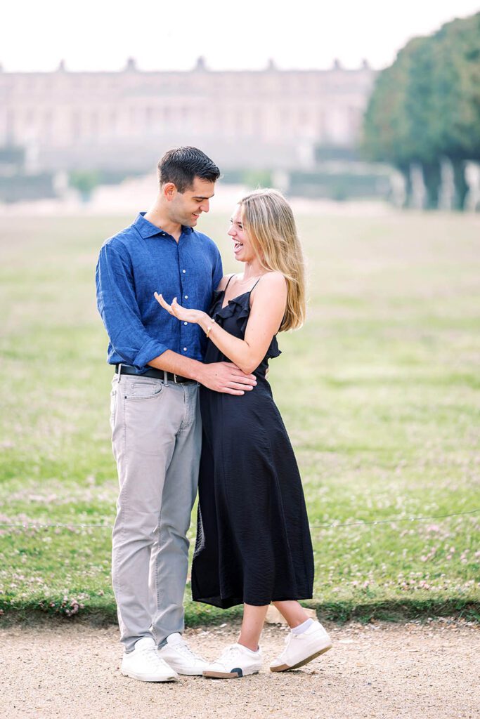 romantic portrait of a couple at the palace of versailles after getting engaged