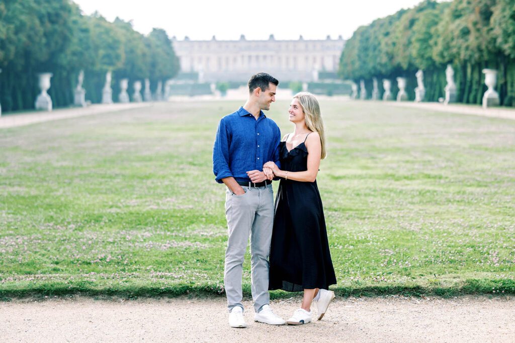 romantic portrait of a couple at the palace of versaillesh looking into each others eyes