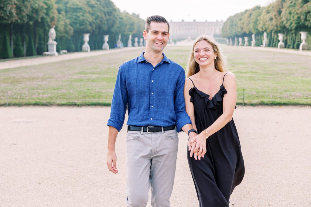 romantic portrait of a couple at the palace of versailles at the end of the tapis vert
