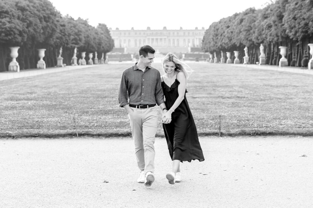 romantic black and white portrait of a couple at the palace of versailles